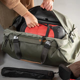 Black Peak Design Travel Duffel 65L with sturdy handles and spacious main compartment, perfect for travel and outdoor adventures.