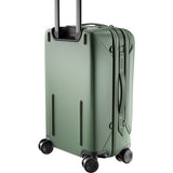 Peak Design Roller Pro Carry-On luggage in sage color, showing the sleek, durable design with wheels and handle for travel.