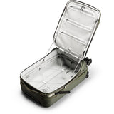 Peak Design Roller Pro Carry-On luggage in sage green with sturdy wheels and sleek design for easy travel.