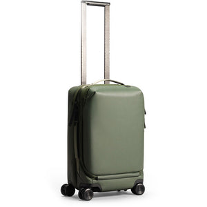 Peak Design Roller Pro Carry-On luggage in sage color with sturdy handle and wheels, designed for convenient travel.