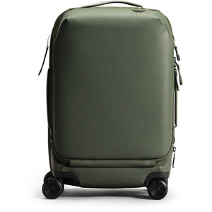 Peak Design Roller Pro Carry-On luggage in sage color, showing the sleek, durable carry-on bag with wheels and handle.