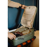 Peak Design Roller Pro Carry-On luggage in sage color, sleek carry-on bag with durable wheels and streamlined design.