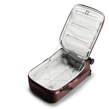 Peak Design Roller Pro Carry-On luggage in sage, featuring durable wheels, sleek handle, and compact design for travel.
