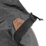 Peak Design packable tote bag displayed open with spacious interior and handles, showcasing its versatile, lightweight design.