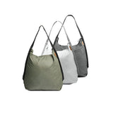 Peak Design packable tote bag folded and partially unfolded, showcasing compact design and durable material for everyday carry.