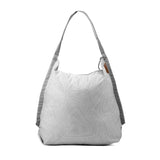 Peak Design packable tote bag shown folded and unfolded, lightweight and versatile for carrying daily essentials.