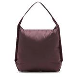 Peak Design packable tote bag folded, showing compact size and sleek design, ideal for versatile everyday use.