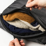 Large Peak Design packing cube with multiple compartments, made of durable fabric, ideal for organizing travel essentials.