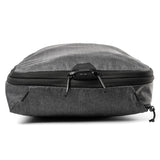 Large Peak Design packing cube with multiple compartments for organized travel storage, shown in a sleek black fabric.