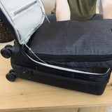 Large Peak Design packing cube with multiple compartments, black fabric, and zipper closure for organized travel storage.