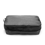 Large Peak Design packing cube with multiple compartments for organized travel storage, shown in gray fabric.
