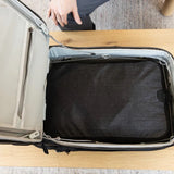 Large Peak Design packing cube with multiple compartments for organized travel storage, made of durable materials.