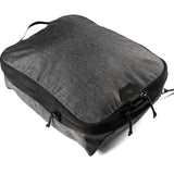 Large Peak Design packing cube with organized compartments, made of durable, lightweight material for travel storage.