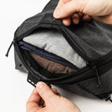 Peak Design Smedium packing cube, black fabric with zipper closure, designed for efficient organization in travel luggage.