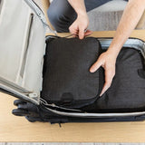 Peak Design Smedium packing cube made of durable fabric, shown opened with organized compartments for travel storage.