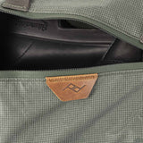 Peak Design Shoe Pouch in sage green, compact travel organizer for shoes, with durable fabric and zipper closure.
