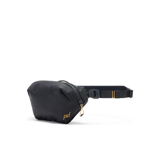 Black Peak Design Outdoor Sling 2L, a compact crossbody bag with adjustable strap and multiple compartments for outdoor essentials.