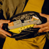 Black Peak Design Outdoor Sling 2L with adjustable strap and compact design, ideal for carrying essentials outdoors.