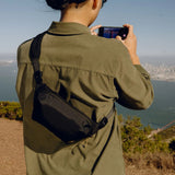 Peak Design Outdoor Sling 2L in black, a compact and versatile shoulder bag for outdoor and everyday use.