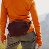 Peak Design Outdoor Sling 2L in Eclipse color, a compact adjustable sling bag with multiple compartments for outdoor essentials.