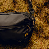 Black Peak Design Outdoor Sling 7L, compact and lightweight sling bag with adjustable strap, ideal for everyday carrying and outdoor activities.