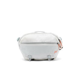 Peak Design Outdoor Sling 7L in cloud color, compact travel bag with adjustable strap and multiple compartments for outdoor gear.