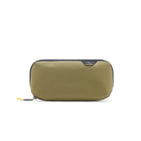 Small Peak Design Tech Pouch in sage, a compact tech kit with multiple compartments for organizing cables and gadgets.