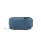 Small Sage Peak Design Tech Pouch used as a compact tech kit with multiple compartments for cables and accessories.