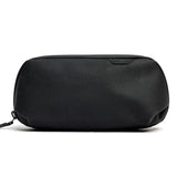 Small Sage Peak Design Tech Pouch used as a tech kit, with compartments for cables, chargers, and accessories.