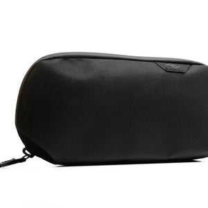 Small Sage Peak Design Tech Pouch with multiple compartments for organizing tech accessories and cables.