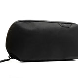 Small Sage Peak Design Tech Pouch with multiple compartments for organizing tech accessories and cables.