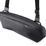 Small Peak Design Tech Pouch in sage color, compact tech kit with organized compartments for gadgets and accessories.