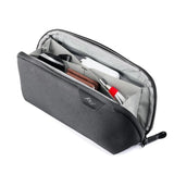 Small Sage Peak Design Tech Pouch used as a compact tech kit with multiple compartments for organizing cables and accessories.