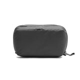 Peak Design Wash Pouch toiletry bag in Coyote X-Pac fabric, compact storage for travel toiletries and personal care items.