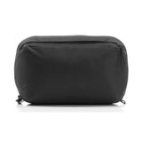 Peak Design Wash Pouch toiletry bag in coyote color with X-Pac material, compact and organized for travel storage.