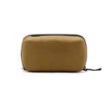 Peak Design Wash Pouch toiletry bag in Coyote X-Pac fabric with multiple compartments for travel organization.