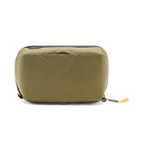 Peak Design Wash Pouch toiletry bag in Coyote X-PAC fabric, with zippered compartments for travel organization.