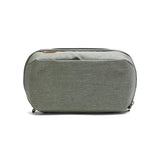 Peak Design Wash Pouch toiletry bag in Coyote X-Pac fabric with multiple compartments for travel essentials.