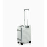 Porsche Design by Bric's Roadster aluminum carry-on luggage with sleek silver exterior and retractable handle, ready for travel.