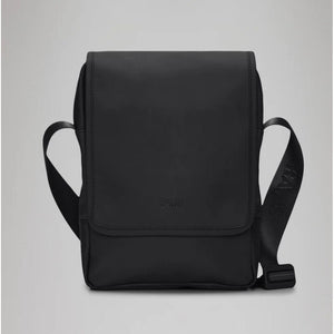 Black Rains Trail Reporter Bag with adjustable shoulder strap and multiple compartments, designed for outdoor and urban use.