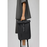 Grey Rains Rolltop Rucksack with adjustable straps and waterproof material, designed for durable everyday use.