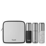 S'well travel bottle set with blue accessories, featuring reusable bottles and stylish travel containers for beverages.