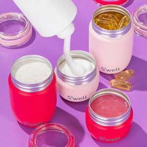 S'well Travel Pod Set of pink accessories, compact travel organizers with multiple compartments for bottles and essentials.