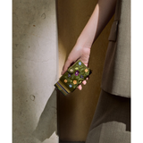 Secrid Premium Miniwallet with green stitch floral design, compact leather wallet with card slots and elegant pattern.