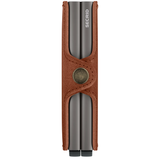 Secrid Twinwallet with saddle leather exterior showing two sides, compact design, and card slots for organized storage.