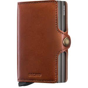 Secrid Twinwallet with saddle brown leather exterior, front view showing compact design and sleek craftsmanship.