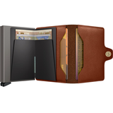 Secrid Twinwallet open showing card slots, leather exterior, and compact design for secure card and cash storage.