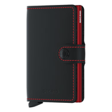 Secrid Miniwallet in matte black and red with front view showing compact wallet design and card slots.
