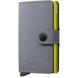 Secrid Miniwallet in matte grey with lime accents, showing the compact wallet design and card slots on the front.