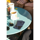 Secrid Miniwallet in matte finish with sleek compact design, shown open with card slots and keyring in a natural setting.